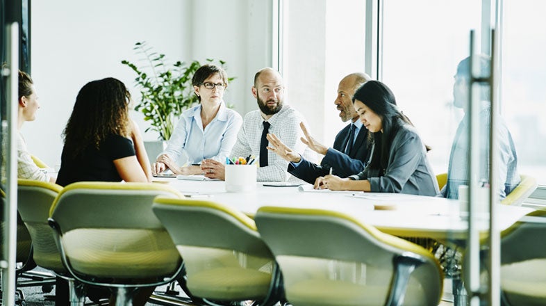 Group of colleagues having a meeting in a contemporary office setting