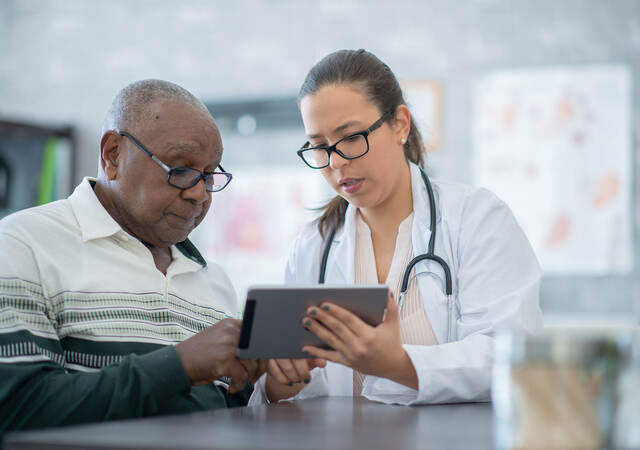 A doctor reviewing results with a patient