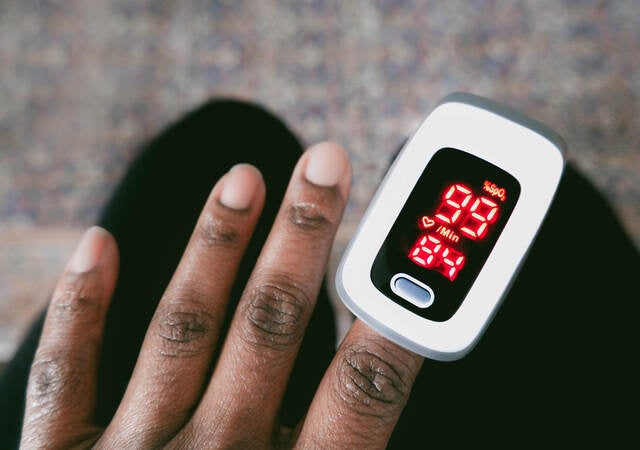 Patient using a pulse oximeter