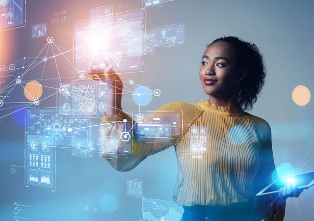 Person analyzing data on a futuristic screen