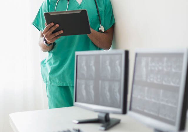 Nurse looking at x-rays