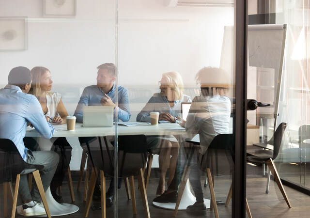 Coworkers attending meeting