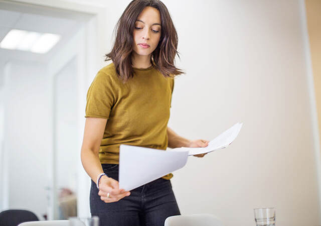 Person reviewing paperwork