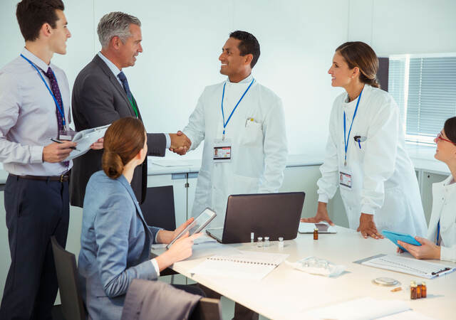 A meeting between business professionals and medical professionals