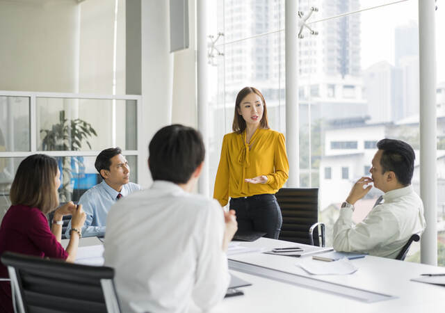 Group of colleagues having a meeting in a contemporary office setting