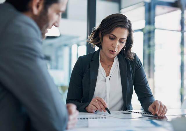 Two business colleagues reviewing documents