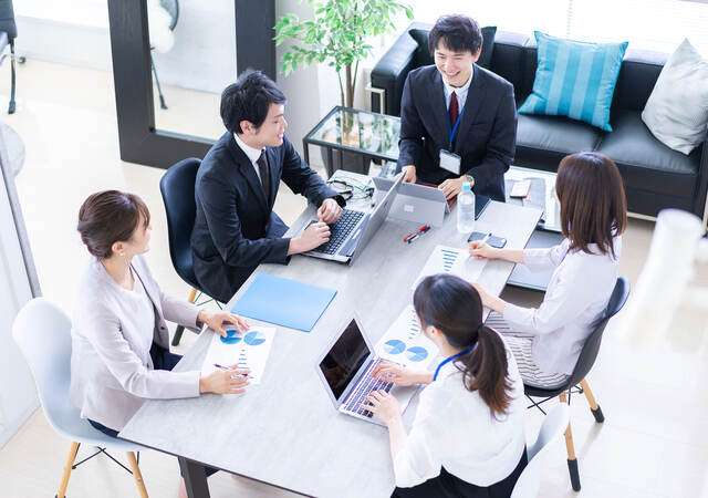 Group of colleagues having a meeting in a contemporary office setting