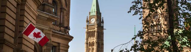 Canadian flags flying at Parliament Hill in Ottawa, Canada