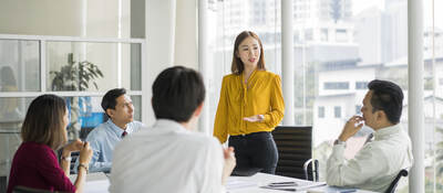 Group of colleagues having a meeting in a contemporary office setting