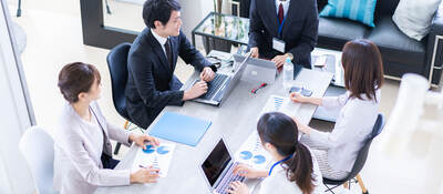 Group of colleagues having a meeting in a contemporary office setting