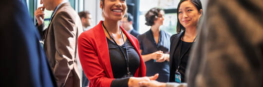 People shaking hands at a business event