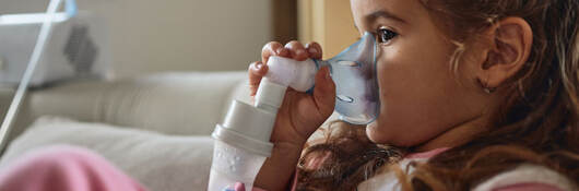 Child using a nebulizer