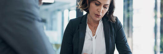 Two business colleagues reviewing documents