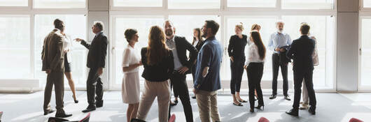 Group of business professionals greeting each other and shaking hands 