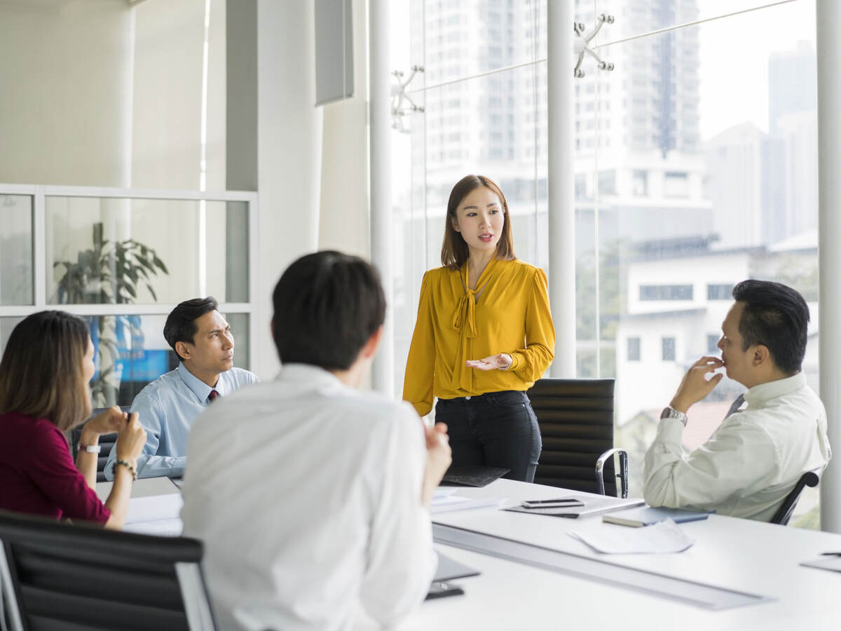 Group of colleagues having a meeting in a contemporary office setting