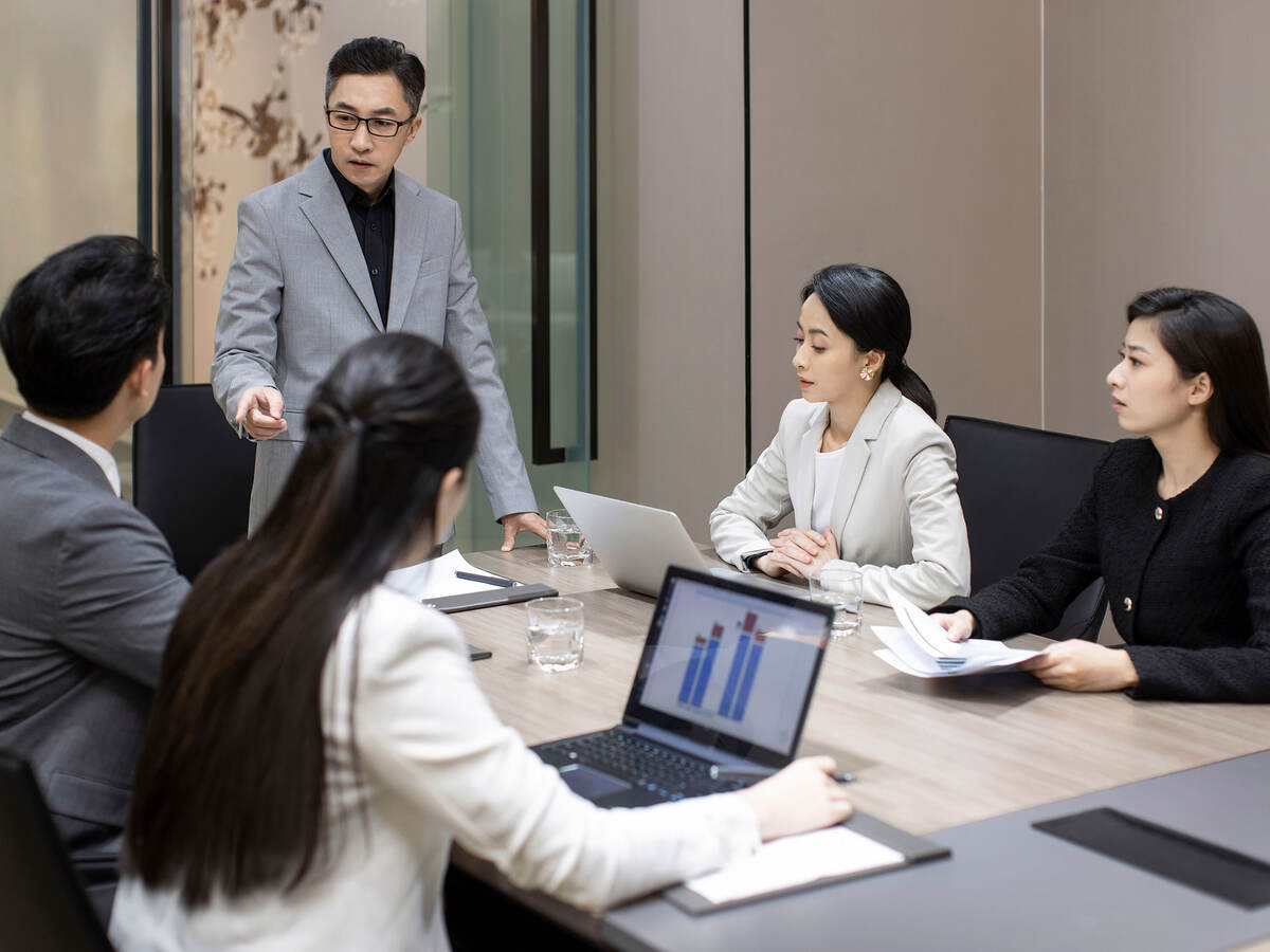 Group of business professionals having a meeting in a conference room