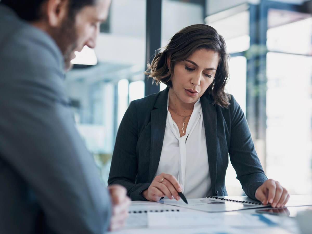 Two business colleagues reviewing documents